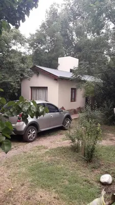 a car parked in front of a house at La arbolada in Villa Ciudad Parque