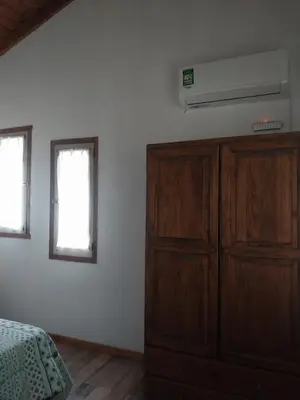 a bedroom with a bed and a chest of drawers at La arbolada in Villa Ciudad Parque