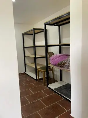 a room with two bunk beds and a chair at Casa Rumipal in Villa Rumipal