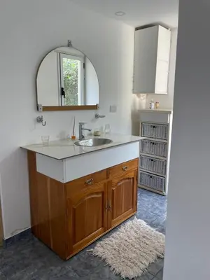 a bathroom with a sink and a mirror at Casa Rumipal in Villa Rumipal