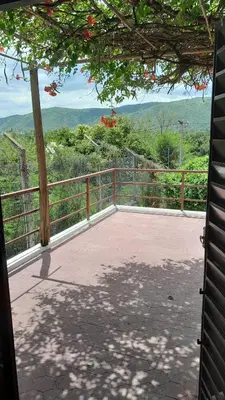 a balcony with a view of the mountains at Gran Malvina in Villa Carlos Paz