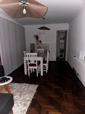 a living room with a dining room table and chairs at Carlis Home in Cordoba