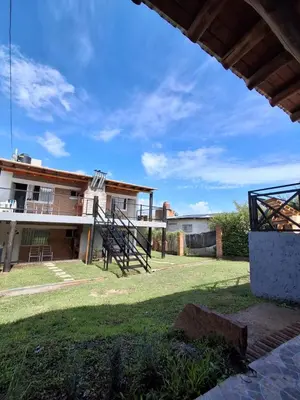 a view of a house with a yard at Complejo Cuarto Menguante in Arroyo de Los Patos