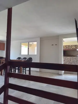 a dining room with a table and chairs at Casa florez in Mina Clavero