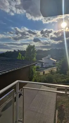 a balcony with a view of a roof at Dúplex La Delfina 3 in Villa Carlos Paz