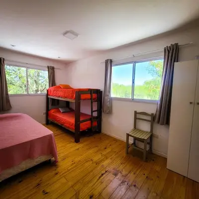 a bedroom with two bunk beds and a window at Casa Moraa in Nono