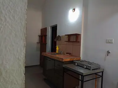 a kitchen with a sink and a stove in it at Alojamiento Quilo in Merlo
