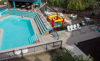 an overhead view of a swimming pool with a playground at Realty vacacional 61 in Villa Carlos Paz
