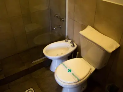 a bathroom with a toilet and a sink at Realty vacacional 61 in Villa Carlos Paz
