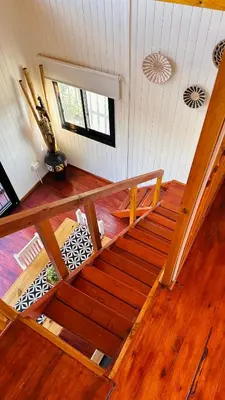 an overhead view of a wooden staircase in a house at Vista Encantada Complejo in Villa Carlos Paz