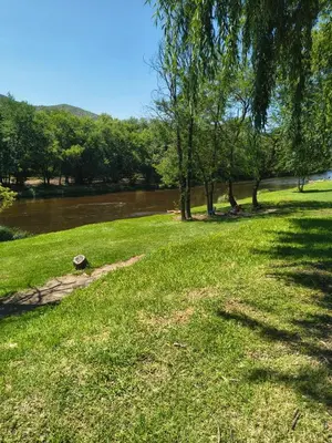 a park with a river and trees and a grass field at Nuevos Aires de San Antonio in San Antonio de Arredondo