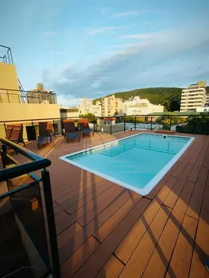 a swimming pool on the roof of a building at Departamento MIRALEJOS 14 in Villa Carlos Paz