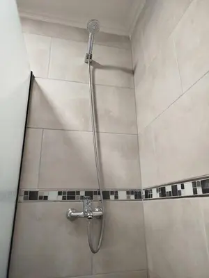 a shower with a shower head in a bathroom at Departamento MIRALEJOS 14 in Villa Carlos Paz