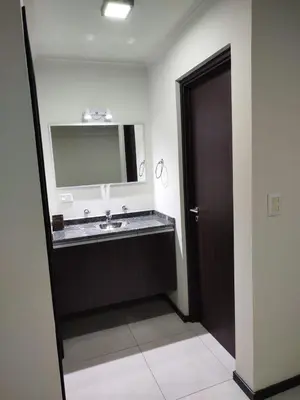 a bathroom with a sink and a mirror at Departamento MIRALEJOS 14 in Villa Carlos Paz