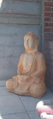a statue of a person sitting on the ground at Mis 4 Soles in Santa María
