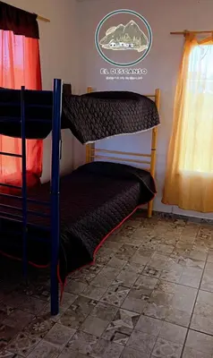a pair of bunk beds in a room at El descanso casita en alquiler in Taninga