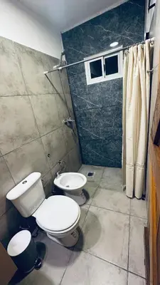 a bathroom with a toilet and a sink and a shower at Los colibríes in Tanti