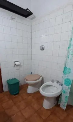 a bathroom with a toilet and a bidet at La casa de Los Abuelos in La Bolsa