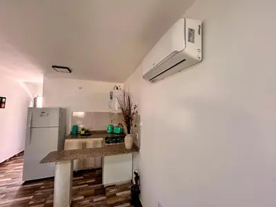 a kitchen with a refrigerator and a counter top at Carpe Diem Cabañas en Panaholma in Panaholma