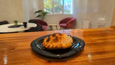 a pastry on a black plate on a table at Terrazas de San Juan in Cordoba