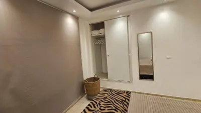 a hallway with a mirror and a zebra rug at Terrazas de San Juan in Cordoba