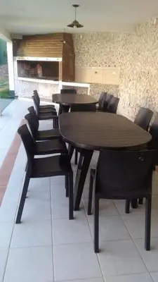 a dining room with a table and chairs at Soles del lago in Villa Carlos Paz