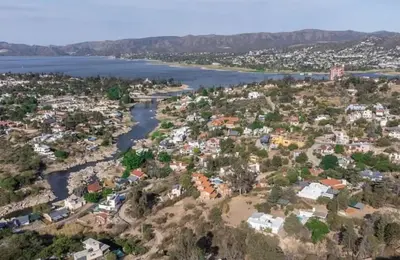 an aerial view of a city and a river at Soles del lago in Villa Carlos Paz