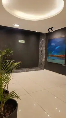 a living room with a large tv on a wall at Sarmiento deluxe B General Paz Pax 4 in Cordoba
