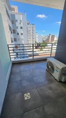 a balcony of a building with a view of the city at Sarmiento deluxe B General Paz Pax 4 in Cordoba