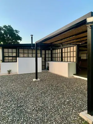 a large white building with a lot of windows at La Casona de Tanti in Tanti