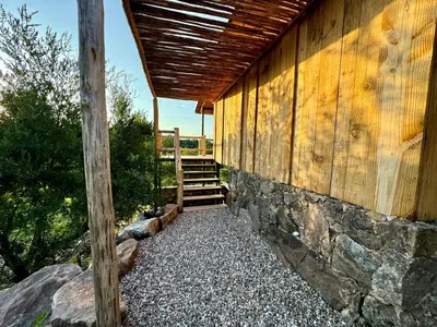 a wooden building with a wooden roof at Cabañas vizcarra in Villa Carlos Paz