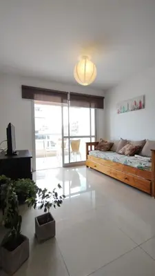 a bedroom with a bed and a television in it at Santa Fe 49 in Cordoba