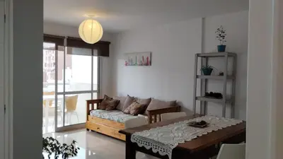 a living room with a couch and a table at Santa Fe 49 in Cordoba
