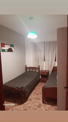 a bedroom with two beds and a window at Mifauna in Villa del Dique