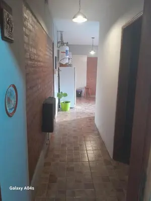 a hallway with a room with a brick wall at Mifauna in Villa del Dique