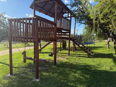 a park with a woodenvisedvisedvisedvisedvisedvisedvisedvisedvisedvisedfficient at Cabañas AdamiS in Villa Cura Brochero