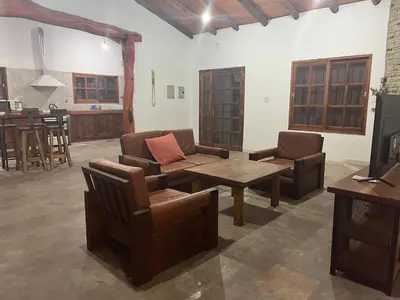 a living room with couches and a coffee table at Casona Las Calles in Las Rabonas