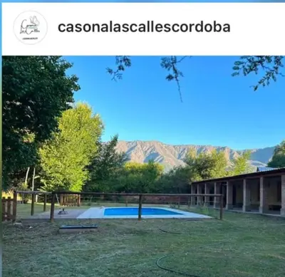 a picture of a playground with mountains in the background at Casona Las Calles in Las Rabonas