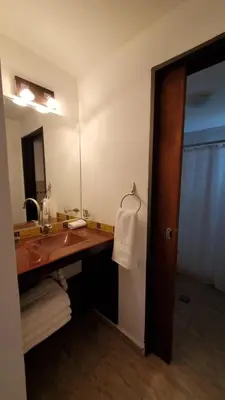 a bathroom with a sink and a mirror at Alojamiento en las sierras 2 dormitorios in Villa General Belgrano