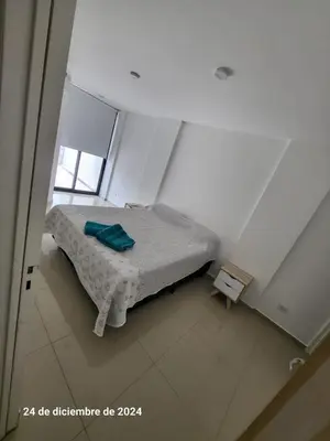 a bedroom with a bed in a white room at plaza Colonn in Cordoba