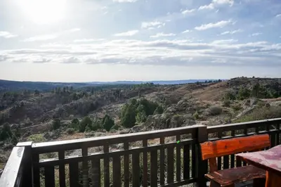 a view from the deck of the overlook at the rim of the canyon at Refugio Alpino in La Cumbrecita