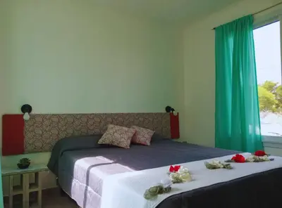 a bedroom with a bed with flowers on it at Cabañas Vista Ensueño in La Estancia