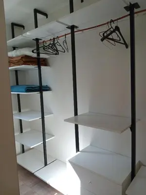 a room with white shelving and white shelves at Cabañas Vista Ensueño in La Estancia