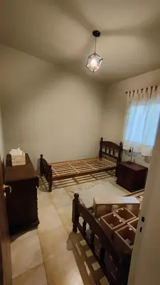 a room with two beds and a table and a window at Apartamento Urbano Bialet Masse in Bialet Massé