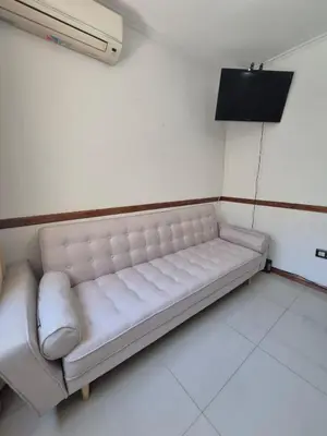a white couch sitting in a room at Departamento Claudio in Villa Carlos Paz