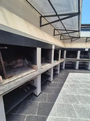 a row of benches sitting in a building at Departamento Claudio in Villa Carlos Paz
