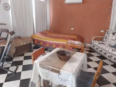 a room with a table with a bowl on top of it at Frente a la sierra in Quebrada de los Pozos