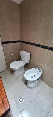 a bathroom with a toilet and a bidet at Cabañas Cerro Colonial in Trapiche