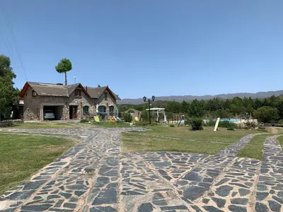 a cobblestone road in front of a house at Cabañas Cerro Colonial in Trapiche