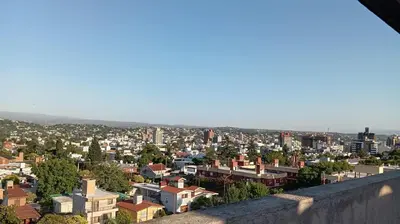 a view of a city from the top of a building at Dept with pool and view in Villa Carlos Paz